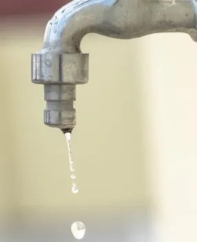 A leaking water faucet